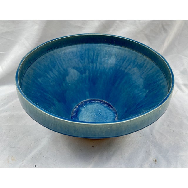 Beautifully crafted drip glaze pottery bowl. Varying shades of cerulean blue create a stunning effect. The drip finish...