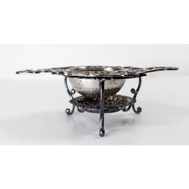 We are selling this interesting silverplate on copper tea strainer and stand. This set both have visible English hallmarks...