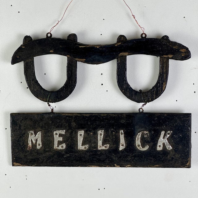A unique hand made small wood antique trade sign, advertising cattle yokes. The tradesman's name was Mellick. It's painted...