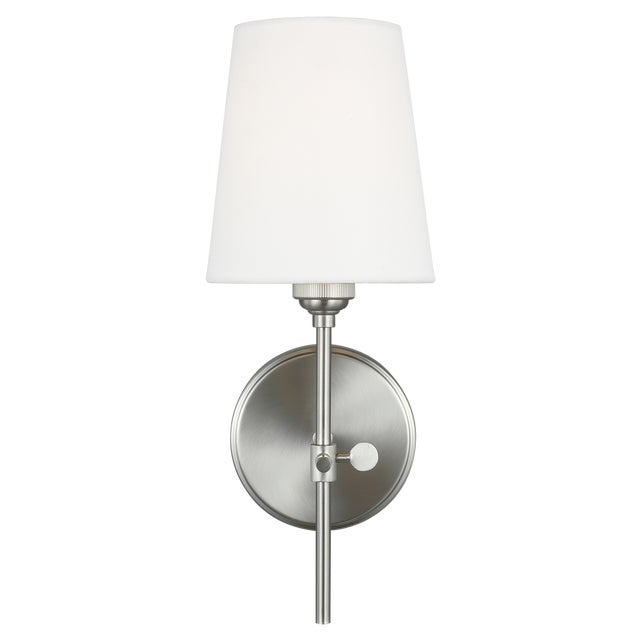 The Baker one light wall sconce in brushed nickel offers shadow-free lighting in your powder room, spa, or master bath...