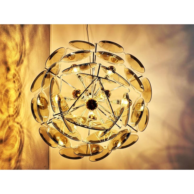 Stunningly beautiful, high-quality 70s Italian design! This Vistosi chandelier is made of chrome-plated steel with 33...