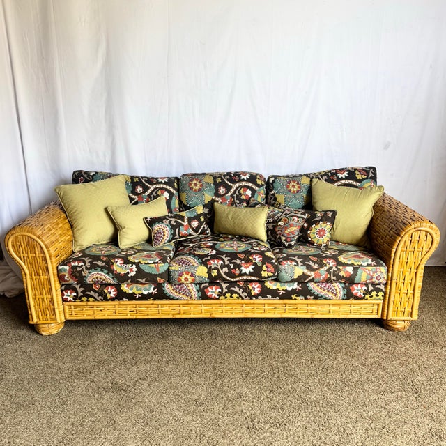 This Boho Chic rattan and bamboo sofa by Ralph Lauren brings island-inspired charm with designer pedigree. Featuring...