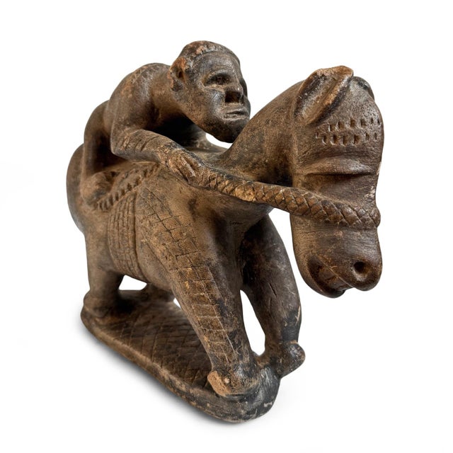 Rare and highly evocative sandstone antique equestrian sculpture from Mali. This remarkable hand-carved figure depicts a...