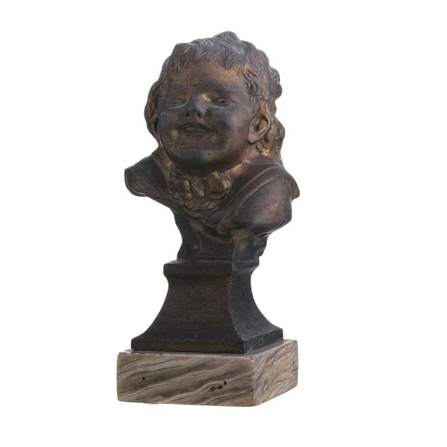 Gilded bronze sculpture, with casting marks. Standing on a marble base. Height: (total) 15.5 cm.