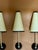 Jean Royere style wall light, black lacquered brass with beige paper lampshade This piece is attributed to the mentioned...