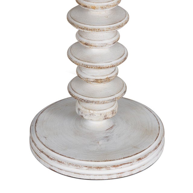 Undulating bands invite the eye up, down, in and around, creating movement in your space. Hand carved by artisans from...