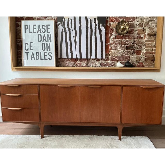 Beautiful vintage mid-century style sideboard by MacIntosh, crafted from warm teak wood. This stylish piece of furniture...