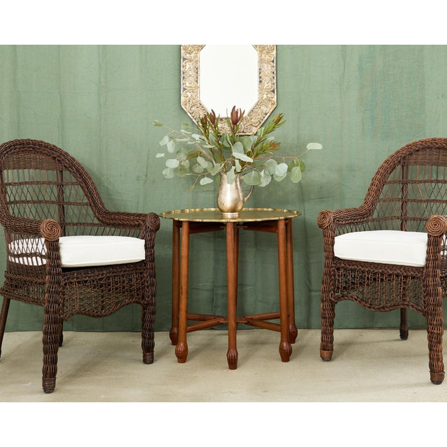 Handsome mid-century modern tray table featuring an Asian inspired etched brass tray top. The tray is subtly incised or...