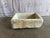 A beautifully hand-carved antique stone sink basin featuring substantial proportions, primitive craftsmanship, and...