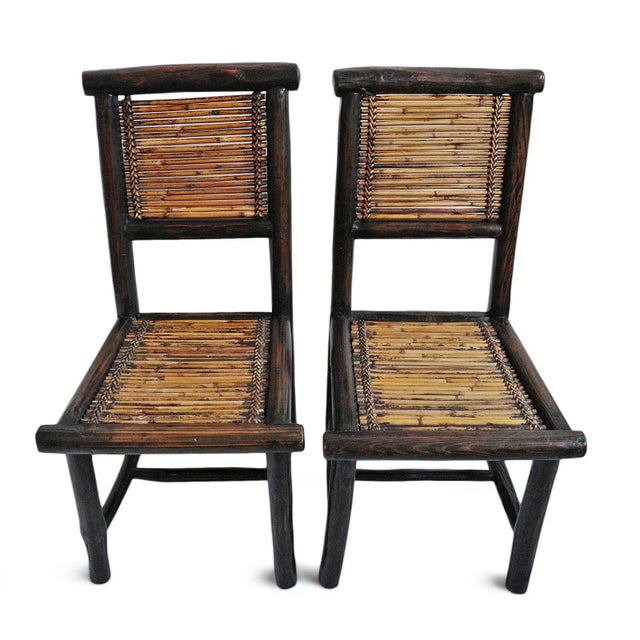 Vintage pair of original bamboo chairs from the Philippines. Authentic beautiful signs of age and use. Sold as a pair.