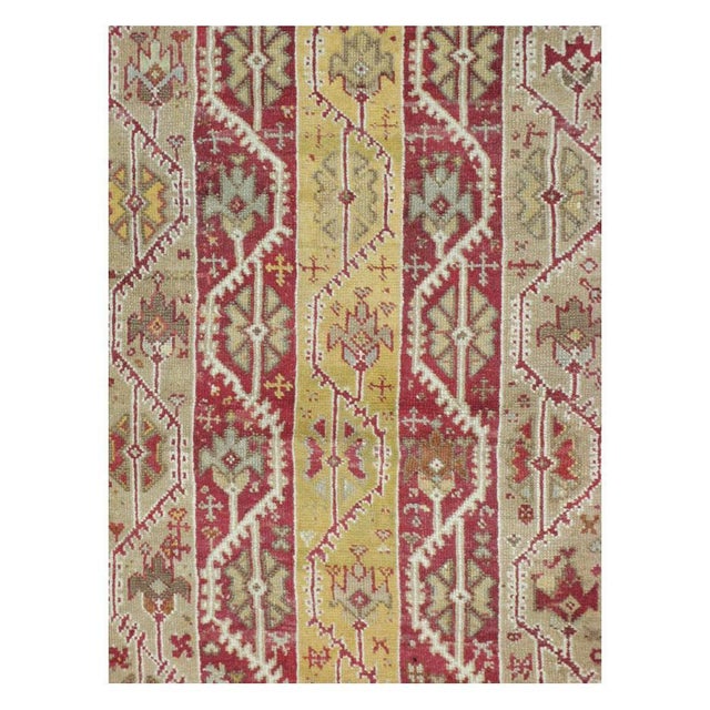 An antique Turkish Oushak room size rug in square format handmade during the early 20th century with a vertical cane...