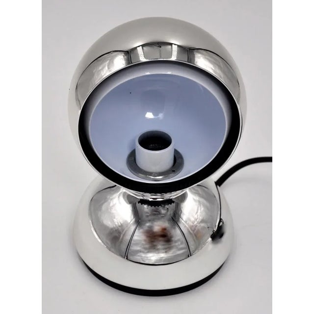 Beautiful chrome Eclisse table lamp from Artemide, designed by Vico Magistretti. This lamp is a modern reissue of the 1965...