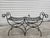 Mid century Neoclassical inspired black painted wrought iron bench, with woven seat metal strapwork and brass accents. A...