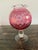 It’s a Vintage Cranberry Etched Vase from the 1950’s. The color is just so vibrant and beautiful. It will bring cheer to...