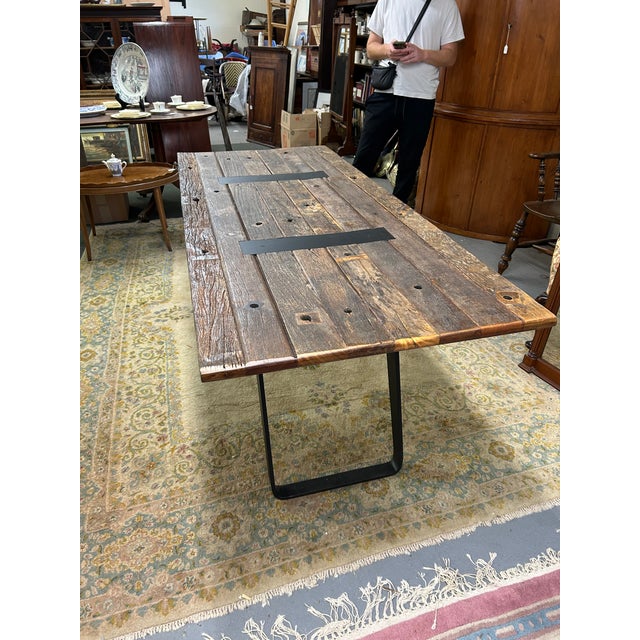 Handsome industrial rectangular dining table or masculine desk having rustic salvage wood top with matte black iron modern...