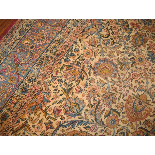 A beautiful over-sized floral Persian carpet woven in the city of Kerman towards the latter stages of the 19th century....