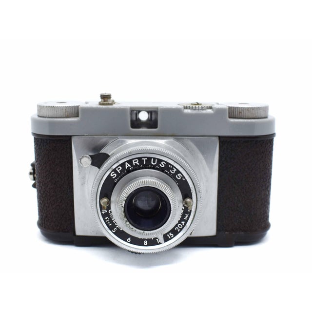 Step back into the golden age of American industrial design with this striking Spartus "35" Model camera. Manufactured in...