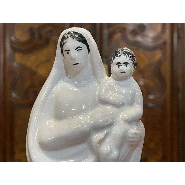 Saint Mary in white earthenware not signed - early 20th century - H = 24.5cm w = 9.8cm d = 6.7cm