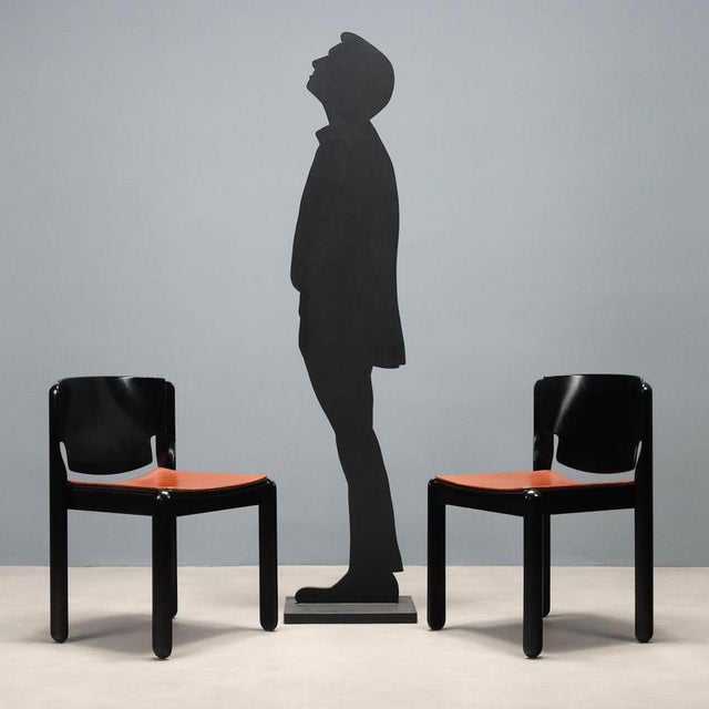 Set of vintage dining chairs designed by Vico Magistretti in 1967 with a wooden frame and curved plywood backrest...