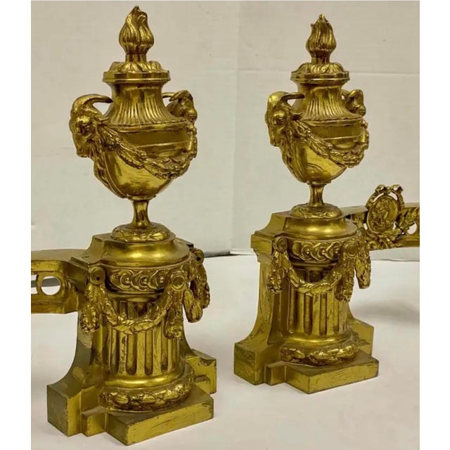 This is a wonderful set of French gilt bronze chenets with neo-classical styling. They have incredible detail and are in...