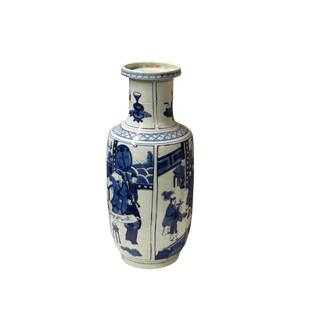 This is a tall, cylindrical Chinese blue and white porcelain vase, likely a "rouleau" or club-shaped vase, decorated with...