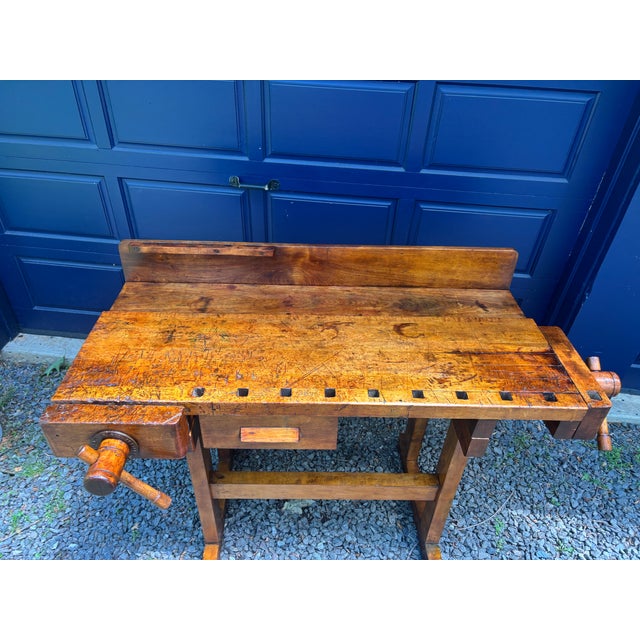 A solid maple workbench, probably dating from the 50's and manufactured by G. Christiansen, Chicago, with a wooden vise at...
