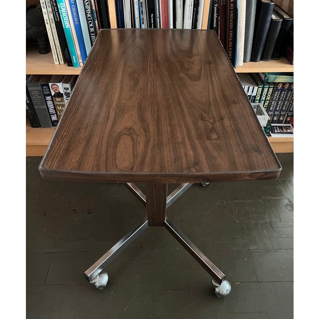 This snazzy side table on wheels is perfect as a bar cart or your flatscreen TV. Hailing from the 1970s it features...