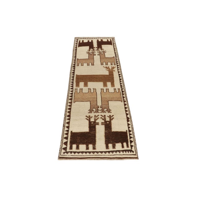 Hand-knotted in wool, a 4x12 rug from Rug & Kilim’s newly unveiled curation of rare tribal pieces. Originating from Turkey...