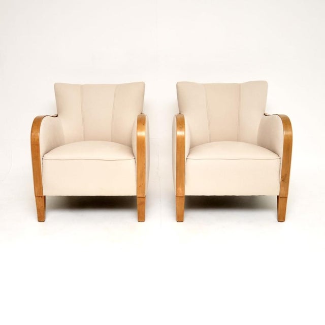 A stunning pair of Swedish Art Deco armchairs in satin birch. These were recently imported from Sweden, they date from the...