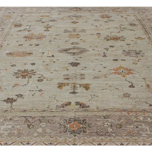 Large Keivan Woven Arts Angora Turkish Oushak Rug with Floral Motifs in Neutral Tones. Keivan Woven Arts/ rug/ AN-134598....