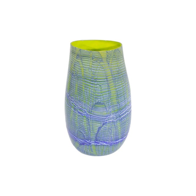 A 2001 blue and green art glass vase by American artist Rod Sounik. The oval, slightly tapered vase features a blue and...