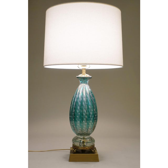 A dramatic and exquisite hand blown "Costolato" ribbed & controlled bubble thick Turquoise Art Glass & Brass sensuous form...