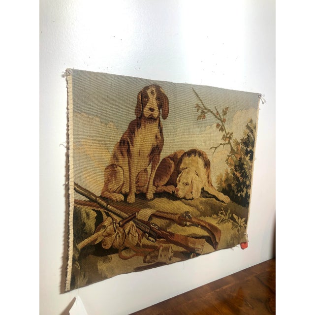 Hand woven 100% wool tapestry fragment featuring a pair of hunting dogs in brown, blue and green colors. Left Facing.