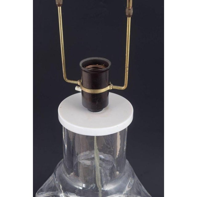 Hanne Dreutler for Kosta Boda Table lamp, 1980s. Sculptural table lamp in clear glass featuring a characteristic...