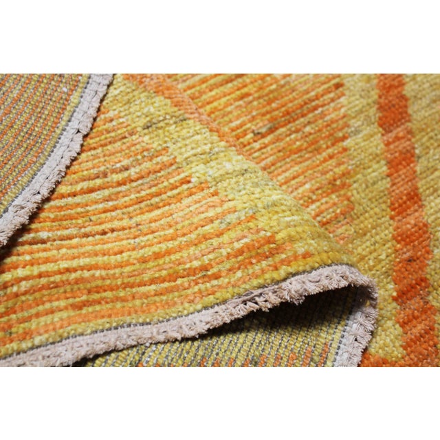 A beautiful handmade rug in Navajo design wit Organic Orange ,Yellow and Ivory colors .These colors bring happiness to...