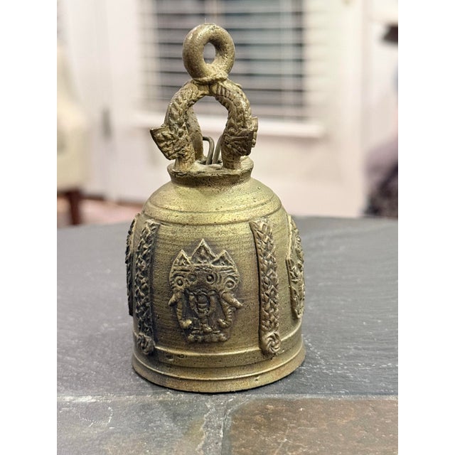 Beautiful vintage solid brass Thai Buddhist temple bell featuring exceptionally intricate raised detailing and traditional...