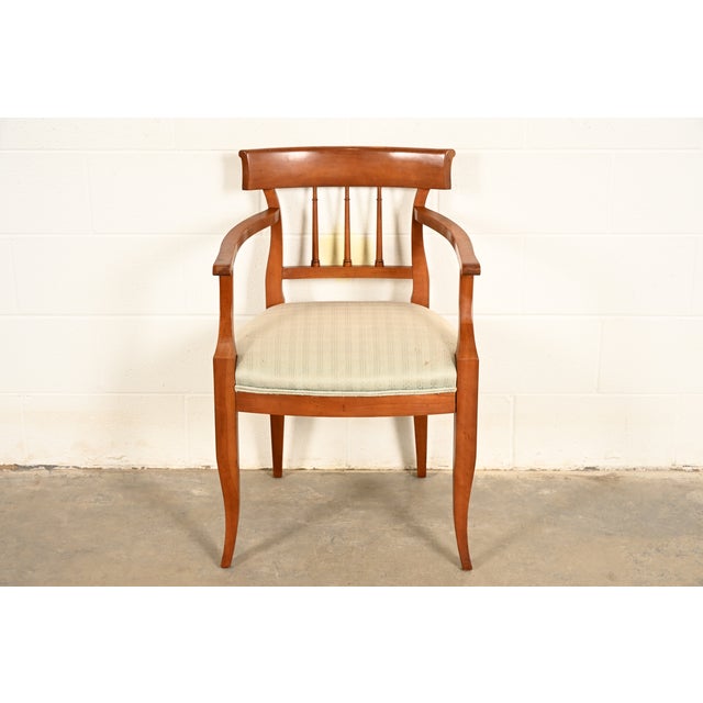 An outstanding Regency or Neoclassical style Klismos armchair or dining captain chair By Kindel Furniture USA, Circa 1980s...
