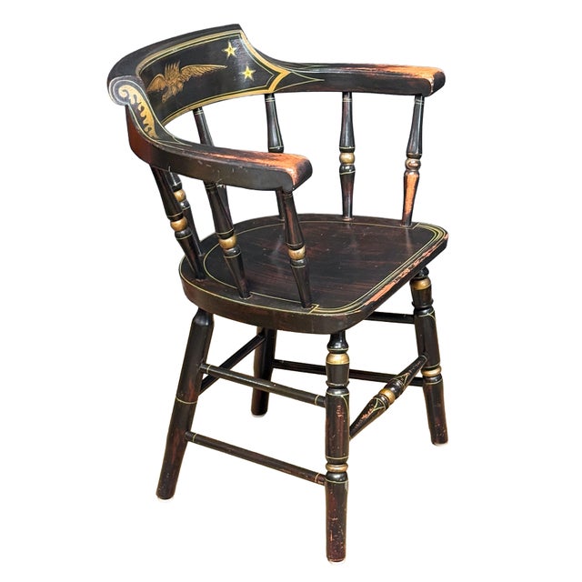 A fine American captain's chair featuring the traditional Federal-style stenciled details on a Windsor chair style frame -...
