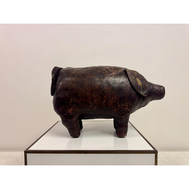 A mid to late 20th century leather pig ottoman produced by Omersa for Liberty, crafted in thick, hand-dyed hide with a...