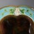 George Jones Majolica serving dish which features strawberries, leaves and blossoms surrounding a central well. Turquoise...
