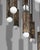 Thirty-two fluted solid brass cylinders are suspended in diamond formation, and a constellation hovering in space. From...