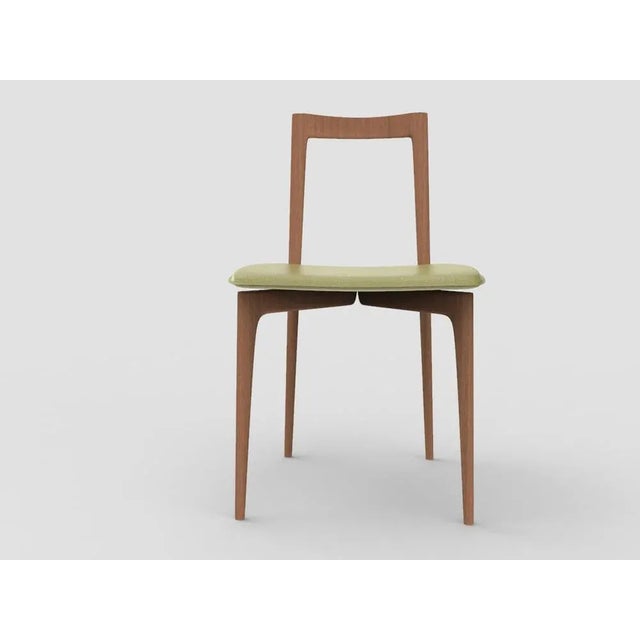 with its light and solid wood structure, this chair is suitable for contemporary interiors. Its proportions and reduced...