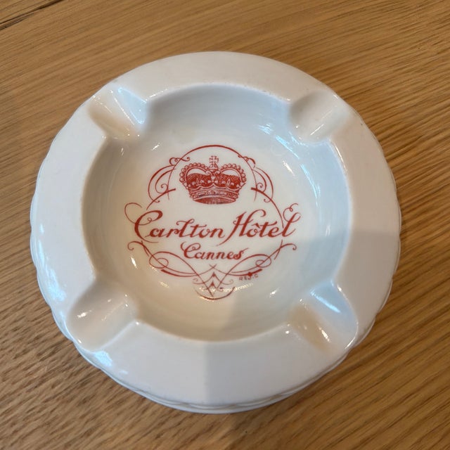 Vintage Carlton Hotel Cannes ceramic ashtray featuring the hotel’s red crest branding. A wonderful...