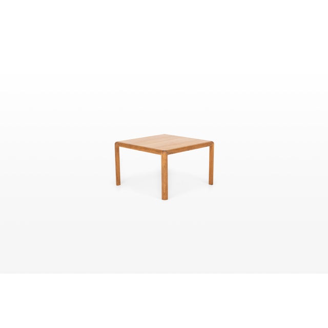 A beautifully crafted oak coffee table from the 1960s, showcasing the understated elegance and exceptional craftsmanship...