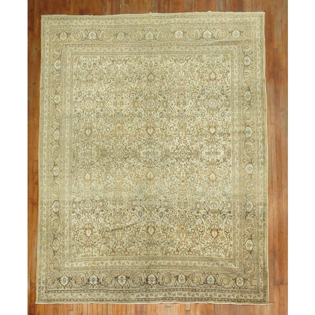 An early 20th century Hadji- Jali- Li Elegant Persian Tabriz Rug. Accents in soft baby blue and brown on an ivory colored...