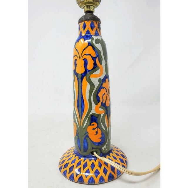 Here is an antique Jules Verlingue small hand painted earthenware table lamp decorated with iris flowers and greenery in...