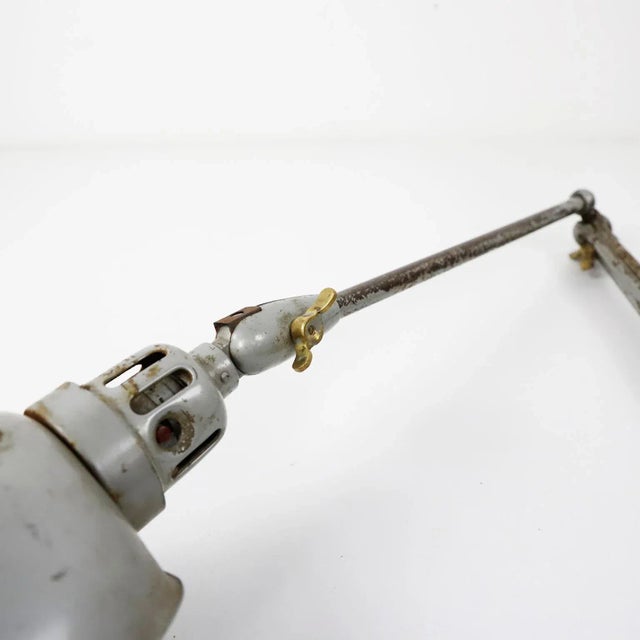 We offer this Vintage industrial adjustable desk table lamp. Measures: circa 1940.