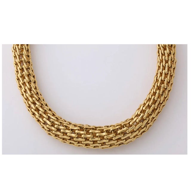Solid Gold 18kt Choker. Significant weight and style in one. Made of assembled Links with a woven look to the rope. 17"...