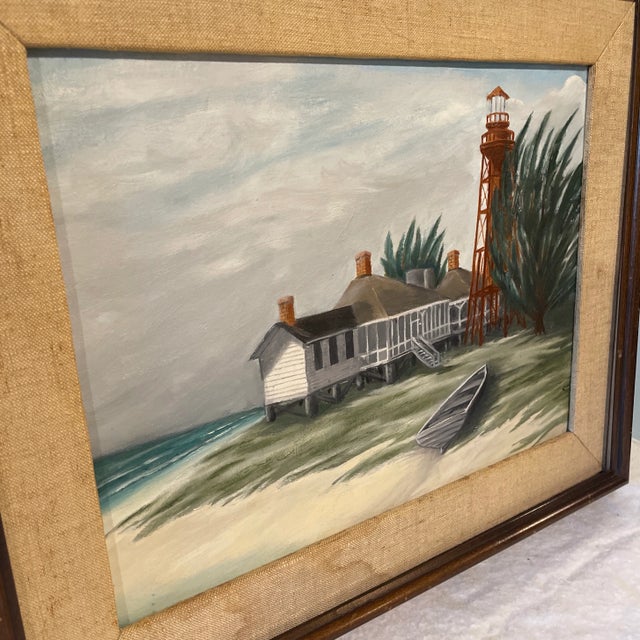 Original oil on board painting depicting a seascape beach scene with a Lighthouse by a Georgia artist, signed King. House...