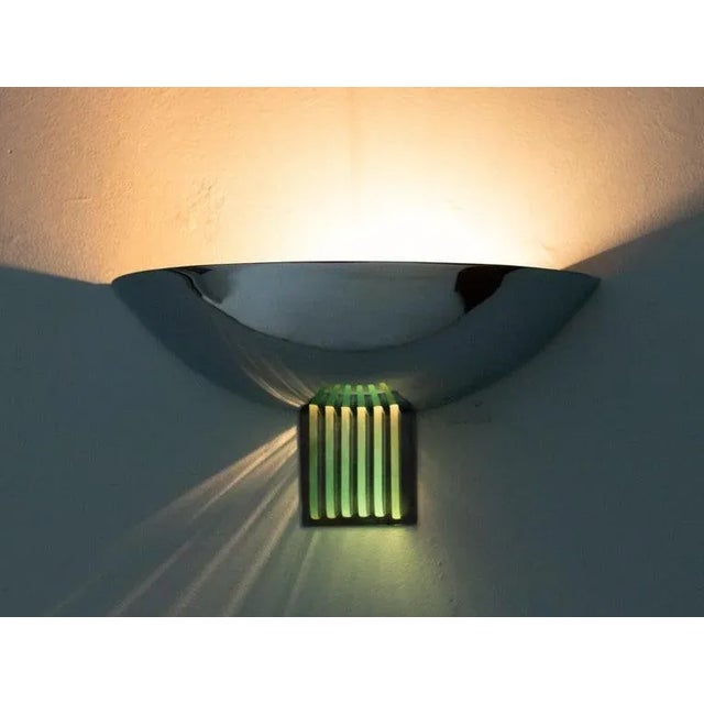 Large pair of Italian chrome-plated steel half dome uplighter wall lamps with green crystal glass plates. The crystal...
